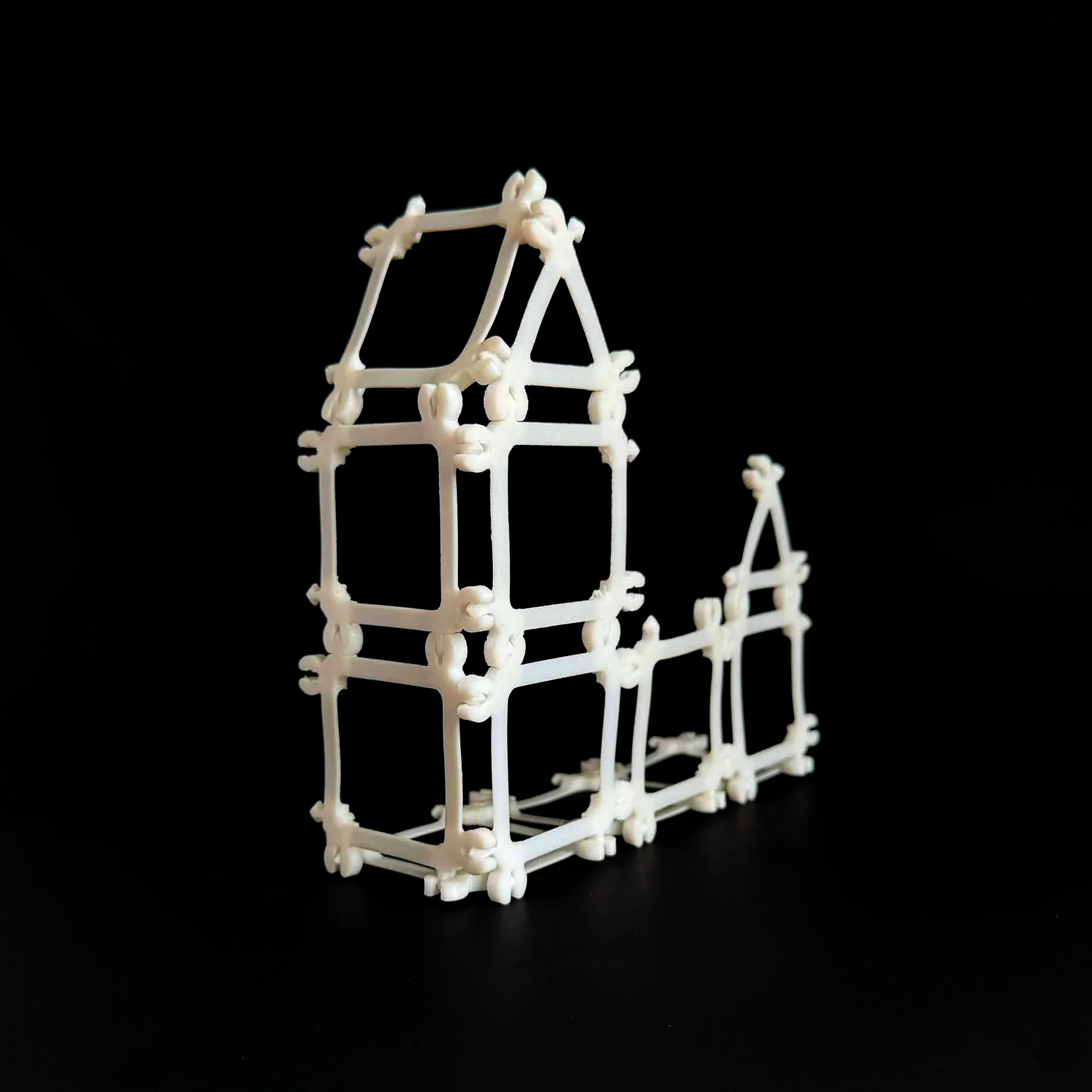 Front view of a house-like Compliagon structure showing the geometry of the assembled form.