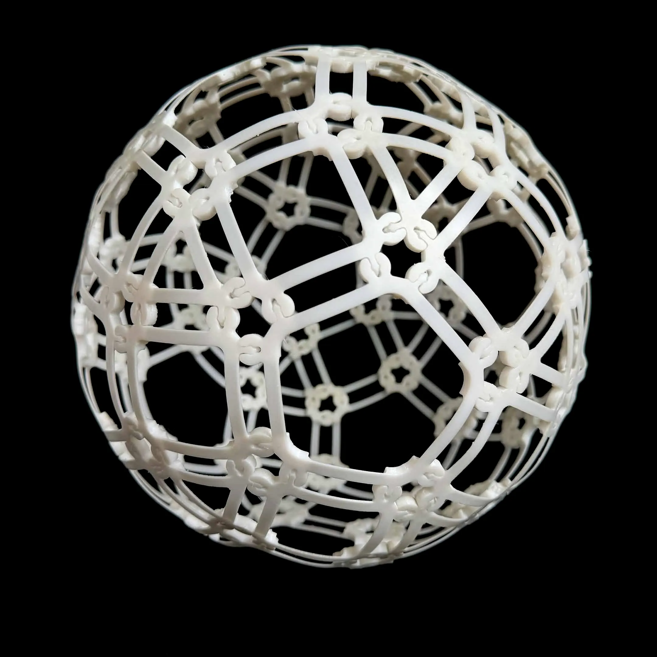A spherical Compliagon form built from interlocking geometric modules.